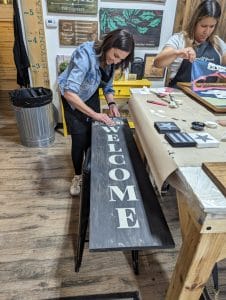 Dani and Priscila working hard on their wood projects.