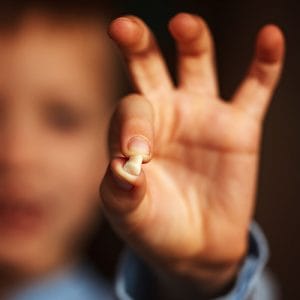 a child preparing for his baby teeth traditions. 