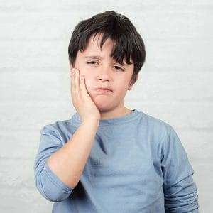 A small boy with a dental emergency