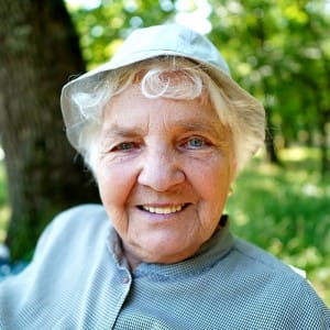 Senior woman with diabetes smiling and showing her teeth