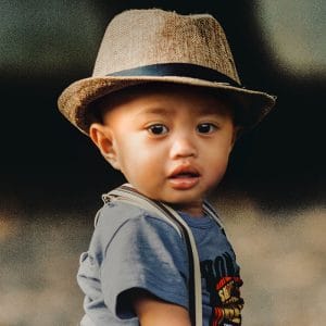 A small child using his mouth to breathe