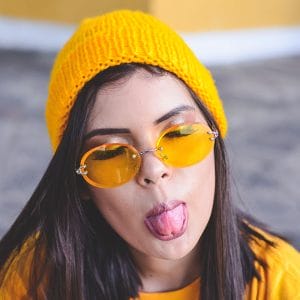 Girl sticking her tongue out showing her taste buds. 