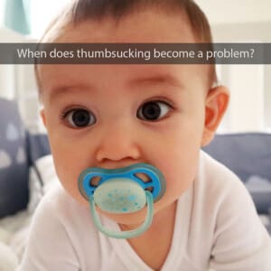 Baby sucking on a pacifier