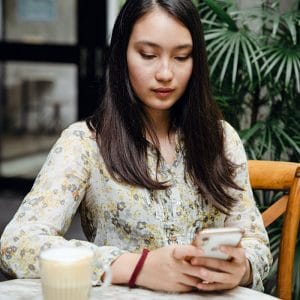 A woman looking at her phone