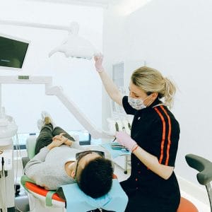 One of our dentistry heroines taking an x-ray on a male patient